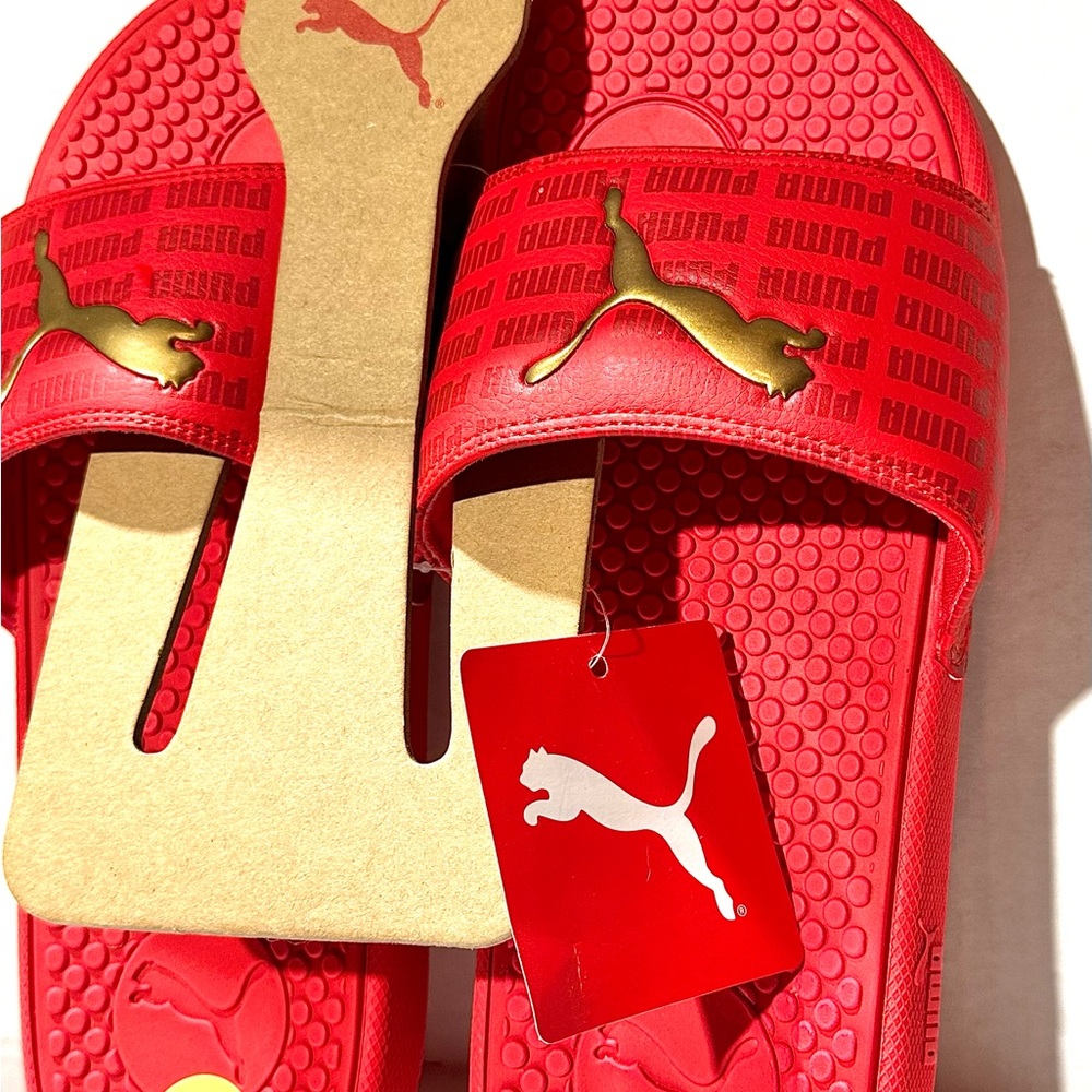 Puma Bold Red Slides with Gold Accent Puma cat on top Woman’s Sz 9. NWT